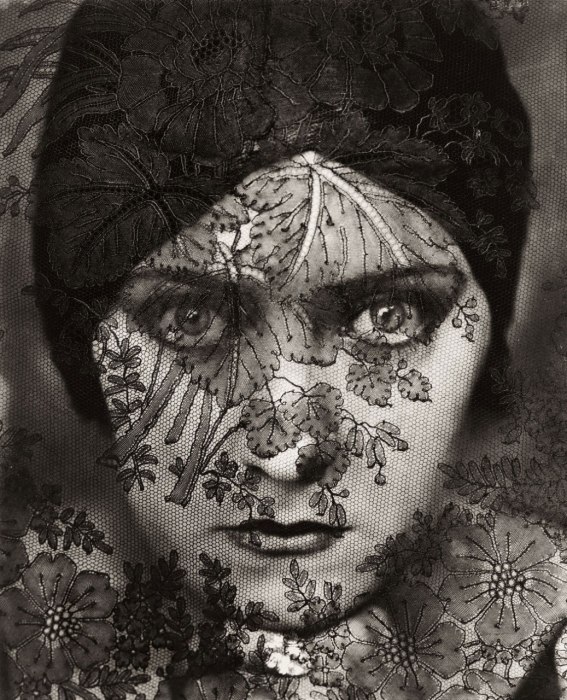 February 1928. Gloria Swanson, behind a curtain of lace, as the first feature-length “talkies” were emerging. By Edward Steichen